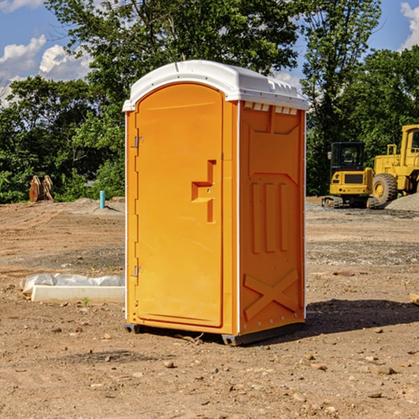 what is the cost difference between standard and deluxe porta potty rentals in Brown